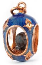 14ct gold and guilloche enamel pendant in the form of an elephant in an egg, set with clear