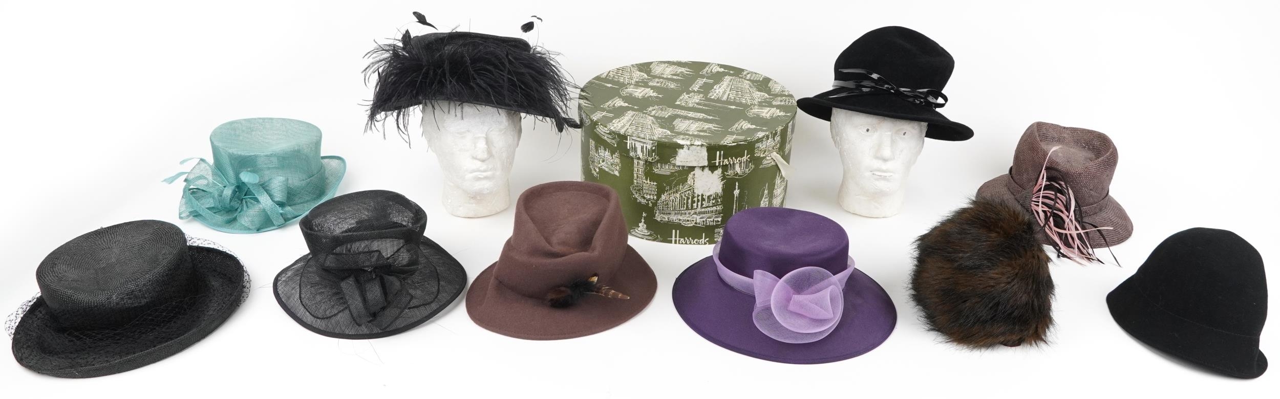 Vintage and later designer fascinator hats including a Harrods example with hatbox, the hatbox