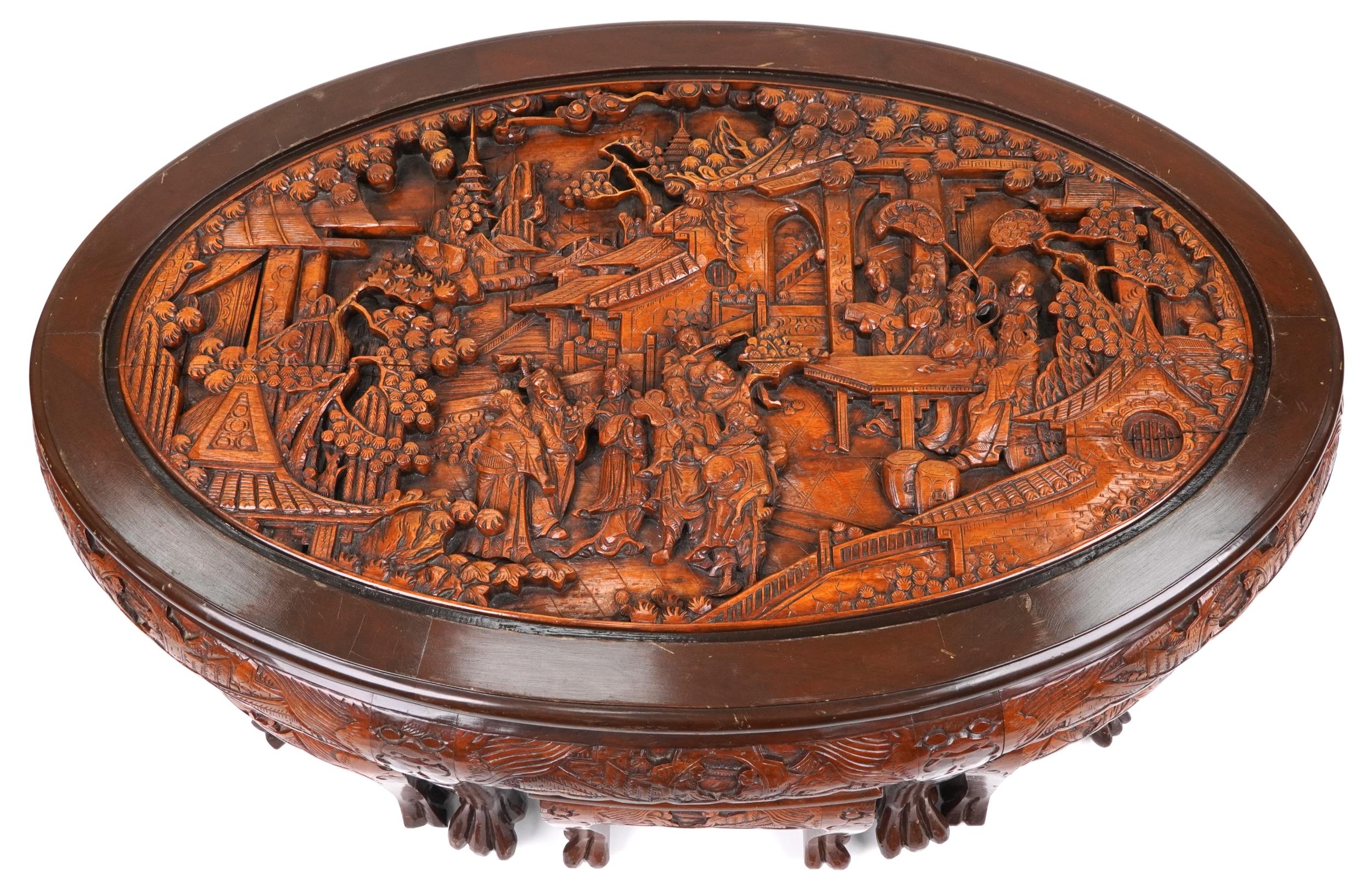 Nest of seven Chinese camphor wood occasional tables comprising an oval coffee table housing six - Image 2 of 9