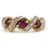 9ct gold diamond and ruby crossover ring, total diamond weight approximately 0.10 carat, the largest