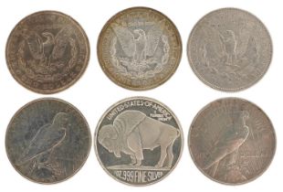 Six 19th century and later United States of America silver dollars including dates 1884, 1886,