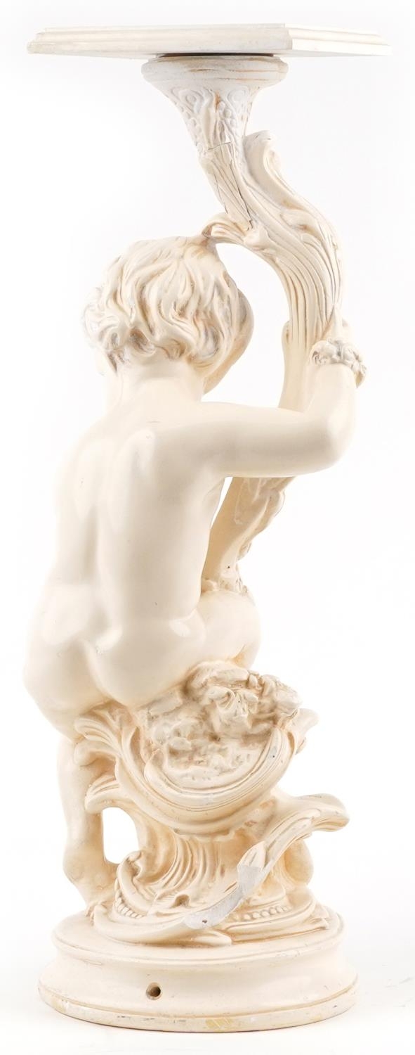 Classical plaster stand in the form of a nude Putti holding a cornucopia, 70cm high - Image 3 of 3