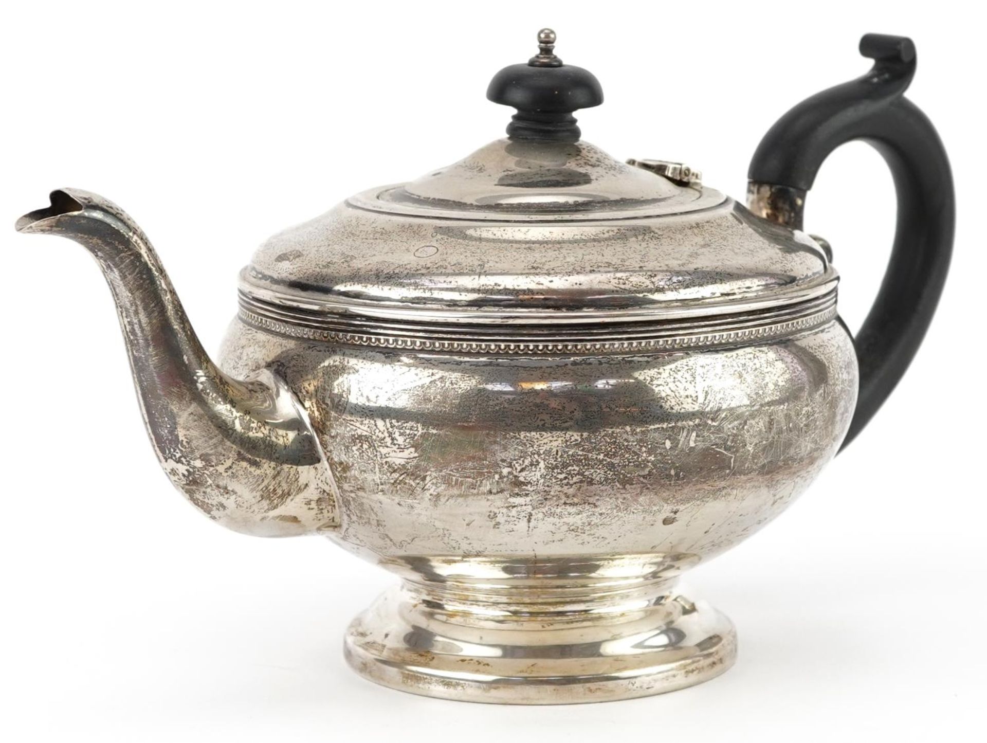 G Bryan & Co, George V silver teapot with ebonised wood handle and knop, Birmingham 1932, 24cm in