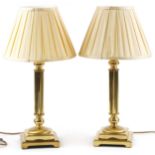 Pair of classical brass Corinthian column table lamps with stepped square bases and silk lined