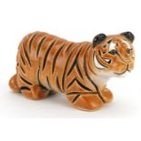 Mid century style stylised pottery tiger, incised marks to the base, 13.5cm in length