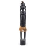 Large African tribal interest carved wood figure of a tribesman, 63cm high