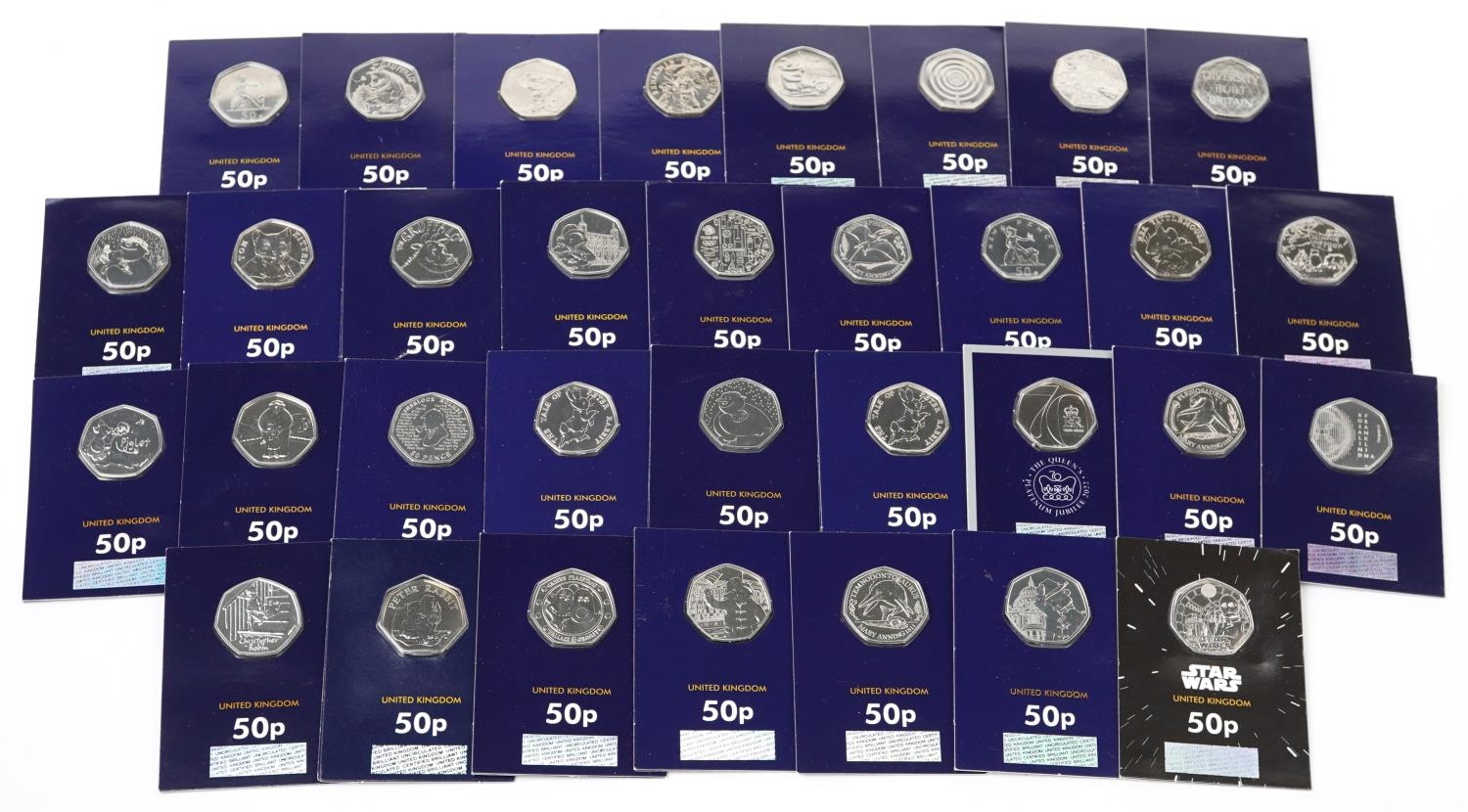 Thirty three Elizabeth II fifty pence pieces housed in Change Checker sleeves, various designs