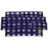 Thirty three Elizabeth II fifty pence pieces housed in Change Checker sleeves, various designs