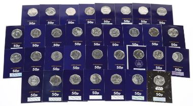 Thirty three Elizabeth II fifty pence pieces housed in Change Checker sleeves, various designs