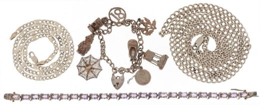 Silver jewellery comprising two necklaces, charm bracelet with a collection of charms and an