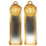 M pair of French Empire style ornate gilt framed wall mirrors with wreath crests and bevelled glass,