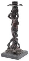 Classical patinated bronze candlestick in the form of a semi nude female on waves, raised on a