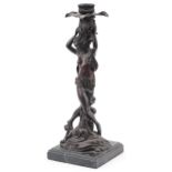 Classical patinated bronze candlestick in the form of a semi nude female on waves, raised on a