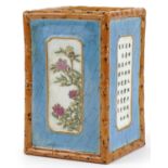 Chinese porcelain square section brush pot hand painted in the famille rose palette with panels of