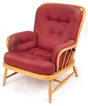 Ercol light elm Jubilee stick back armchair with red fleur de lis upholstered cushioned seats,
