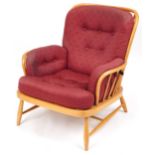 Ercol light elm Jubilee stick back armchair with red fleur de lis upholstered cushioned seats,