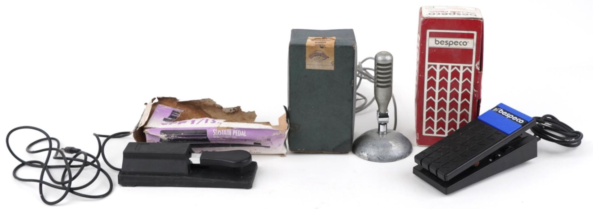 Two vintage keyboard volume foot pedals and a vintage microphone with boxes comprising Ribbonette,