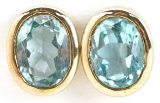 Pair of 9ct gold blue topaz stud earrings, each topaz approximately 8.20mm in x 6.20mm x 3.90mm