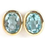 Pair of 9ct gold blue topaz stud earrings, each topaz approximately 8.20mm in x 6.20mm x 3.90mm