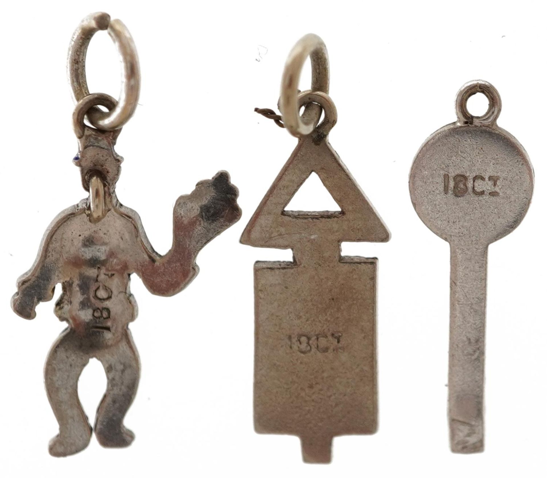 Three 18ct white gold and enamel charms in the form of a policeman, crossroads traffic sign and a - Image 2 of 3