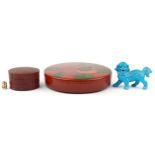 Two Japanese lacquered boxes and covers and a Chinese porcelain qilin having a turquoise glaze,