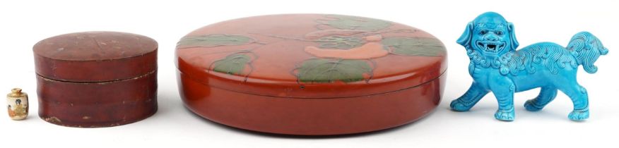 Two Japanese lacquered boxes and covers and a Chinese porcelain qilin having a turquoise glaze,