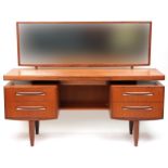 G Plan, Mid century Fresco teak dressing chest with mirrored back fitted with an arrangement of four
