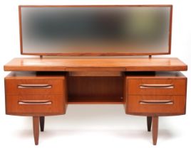 G Plan, Mid century Fresco teak dressing chest with mirrored back fitted with an arrangement of four