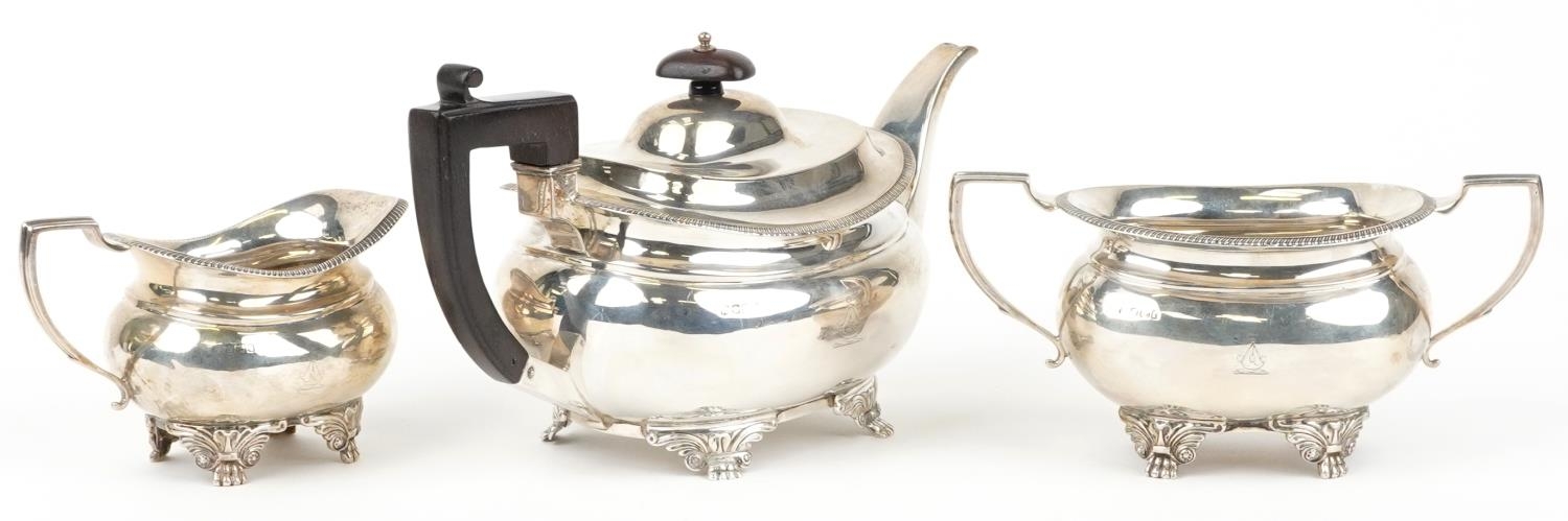 Daniel & John Wellby, Victorian silver three piece tea service, the teapot with wooden handle and - Image 2 of 6