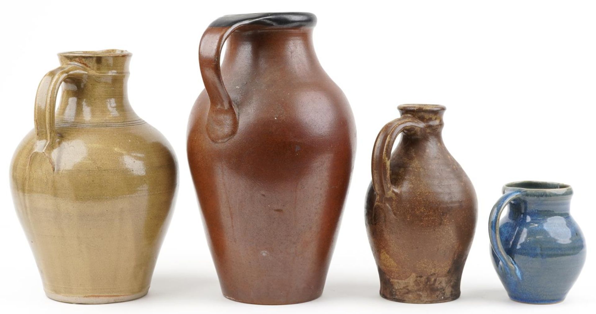 Three studio pottery jugs and a flagon including a blue glazed example by Winchcombe, the largest - Image 2 of 5