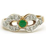 9ct gold emerald and diamond double crossover ring, size O/P, 3.3g