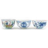 Three Chinese porcelain bowls including a blue and white example hand painted with stylised