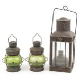 Three shipping interest hanging lanterns including a pair with green glass, the largest 47cm high