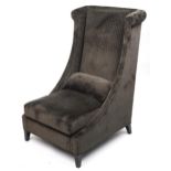 Contemporary dark olive green upholstered throne lounge chair with ebonised legs and cushion,