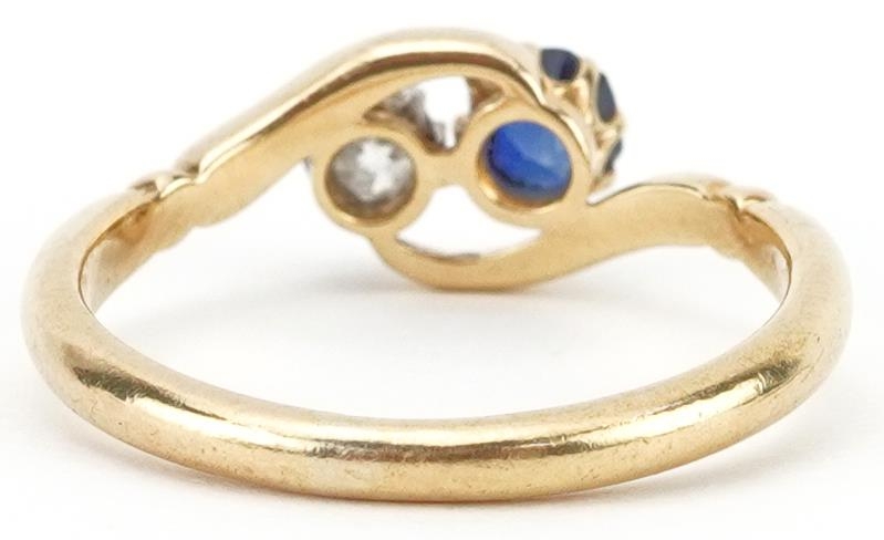 Unmarked gold diamond and sapphire crossover ring, tests as 18ct gold, the diamond approximately 0. - Image 2 of 3