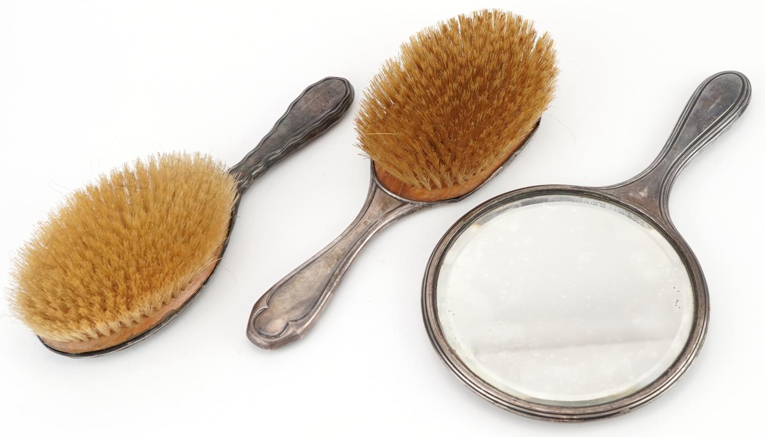 Two Edwardian silver backed clothes brushes and a hand mirror, the largest 27cm in length - Image 2 of 4