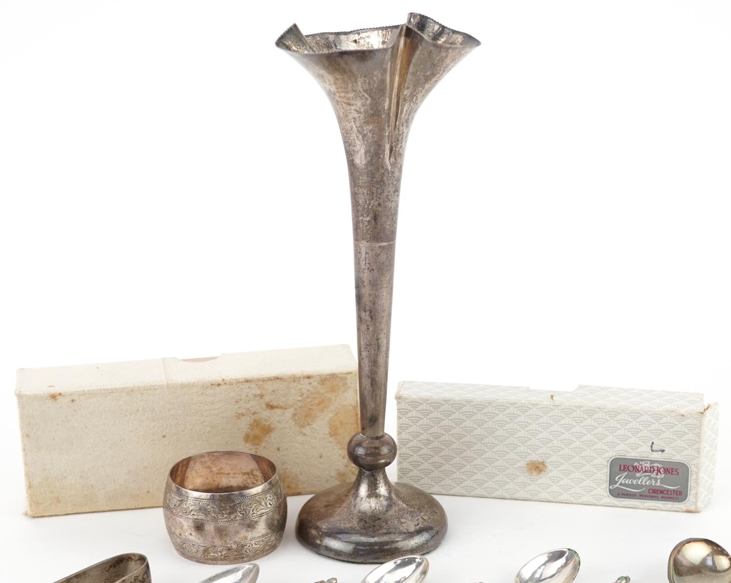 Silver objects comprising seven teaspoons, napkin ring, sugar tongs and bud vase, the largest 19.5cm - Image 2 of 8