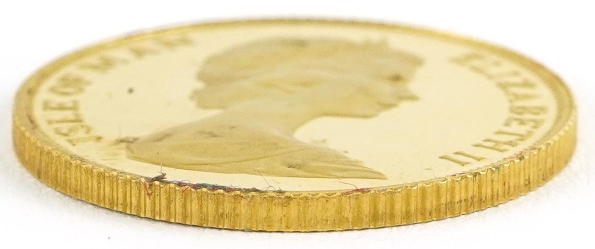 Elizabeth II Isle of Man 1983 Manx gold proof sovereign housed in a Pobjoy Mint book design case - Image 3 of 4