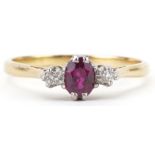 18ct gold ruby and diamond three stone ring, the ruby approximately 5.50mm x 4.50mm x 2.80mm deep,