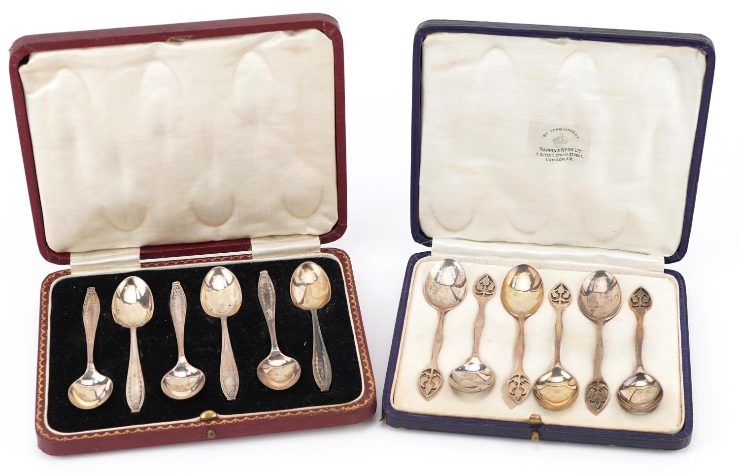 Two sets of six silver teaspoons with fitted cases including a set by Mappin & Webb, each 11cm in