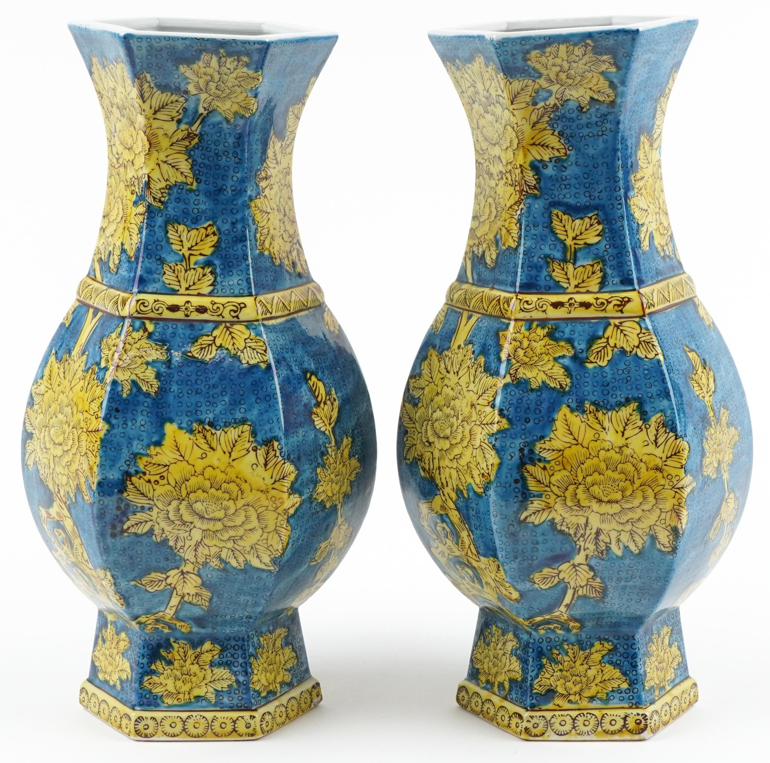 Pair of Chinese porcelain hexagonal blue ground vases hand painted with flowers, each 40cm high