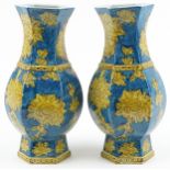 Pair of Chinese porcelain hexagonal blue ground vases hand painted with flowers, each 40cm high