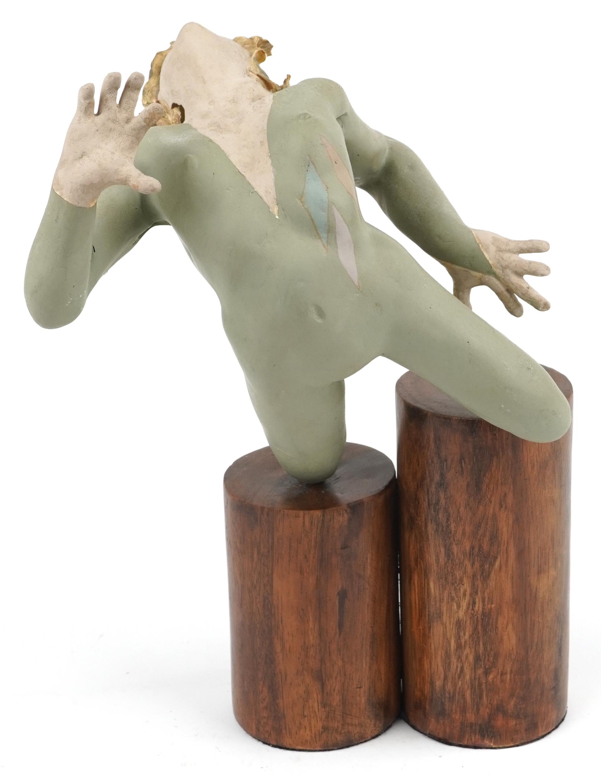 Neil Wilkinson, contemporary Brutalist painted resin sculpture of a nude female on double circular