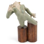Neil Wilkinson, contemporary Brutalist painted resin sculpture of a nude female on double circular