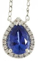 18ct white gold pear cut tanzanite and diamond cluster pendant on a 18ct white gold necklace with