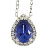 18ct white gold pear cut tanzanite and diamond cluster pendant on a 18ct white gold necklace with