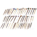 Collection of sewing interest carved bone and hardwood lace making bobbins with beads