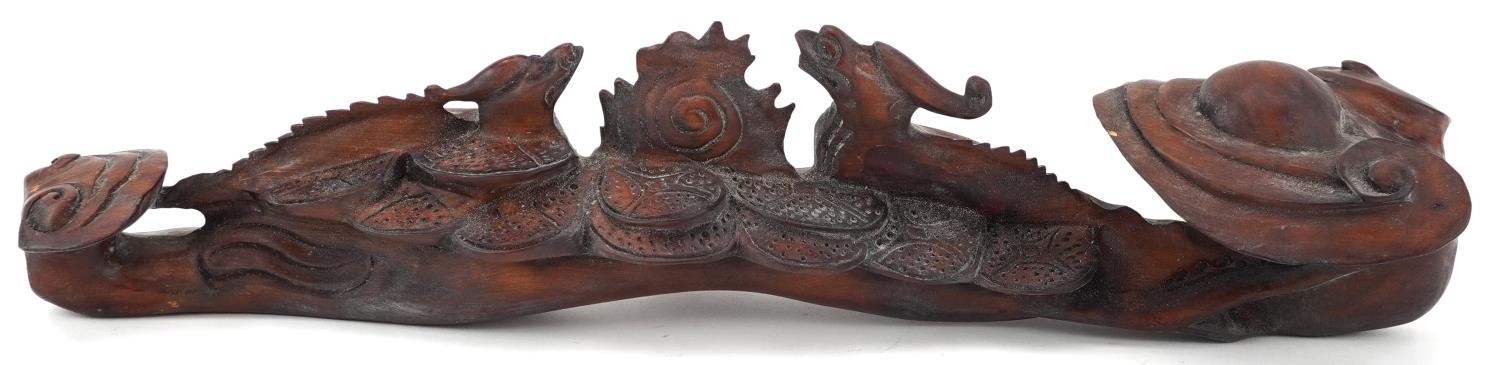 Chinese hardwood ruyi sceptre carved with two dragons chasing the flaming pearl, 43cm wide - Image 5 of 8