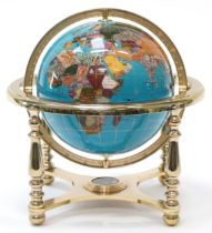 Contemporary polished stone table globe with brass stand and compass under tier, 33cm high