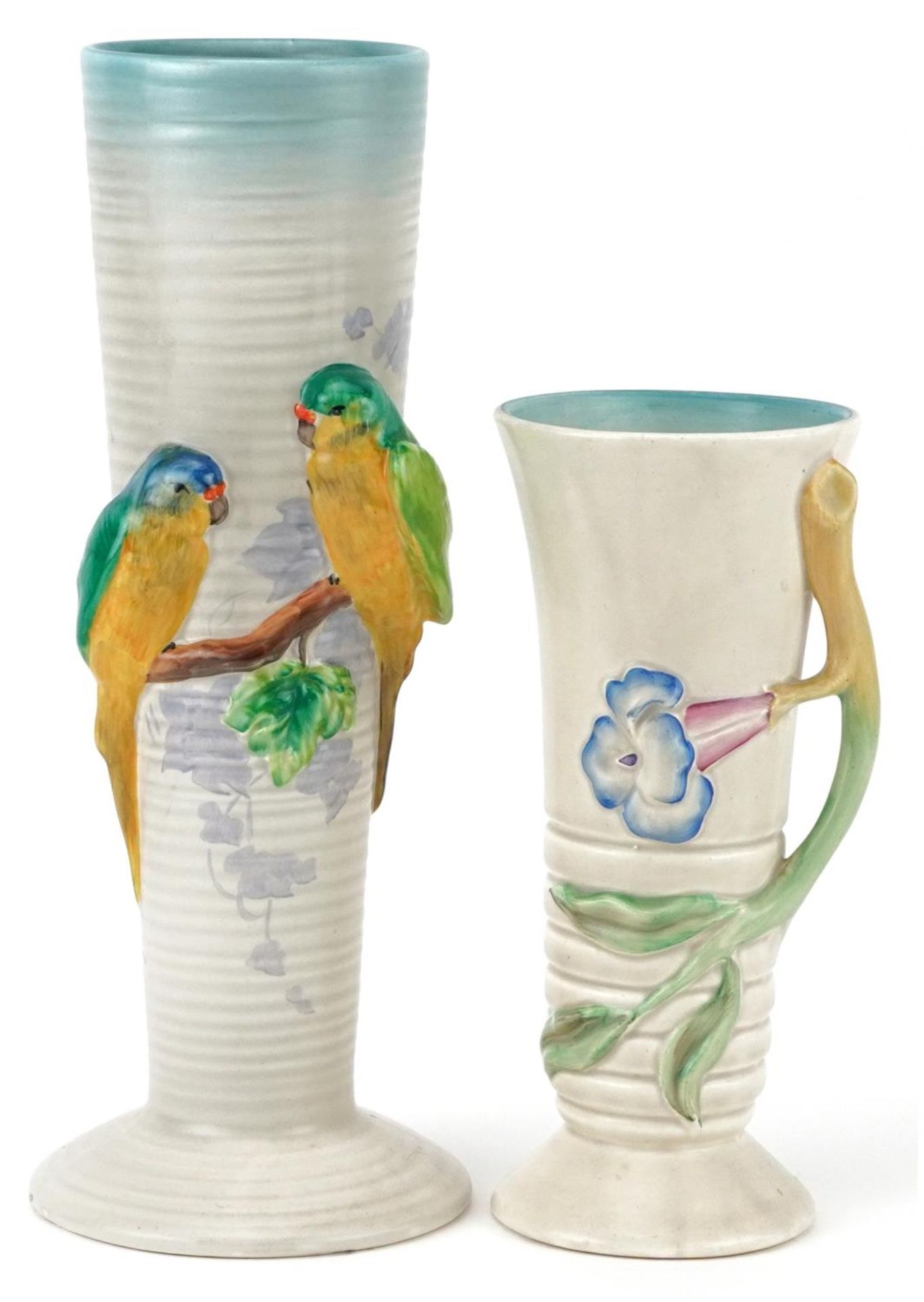 Clarice Cliff, two Art Deco cylindrical and tapering vases including one decorated in relief with